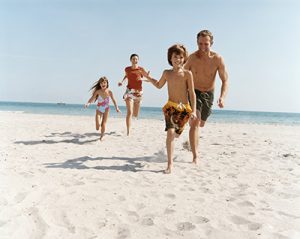 Family Running on a Beach
